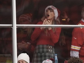 Taylor Swift is seen in a suite before the start of an NFL football game between the Kansas City Chiefs and the Las Vegas Raiders on Dec. 25, 2023, in Kansas City, Mo.