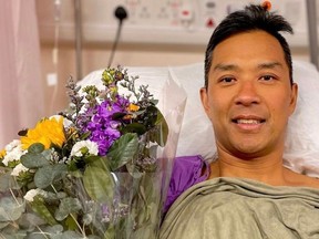 Christopher Won, an assistant fire chief with Vancouver Fire and Rescue, in hospital in Hong Kong.