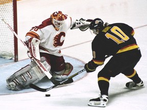 Vancouver Canucks Pavel Bure scoring the winning goal against Mike Vernon in the second overtime period against the Calgary Flames, April 30, 1994.