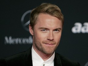 FILE - Irish singer Ronan Keating arrives for the Laureus Awards in Abu Dhabi, United Arab Emirates, on Feb. 7, 2011. Chorley could be the next soccer club from the English non-leagues to be given a sprinkle of celebrity stardust. The sixth-tier team from northwest England says it is in "ongoing discussions" with Boyzone in hopes of the Irish boy band fronted by Ronan Keating becoming "the face of the football club."