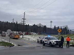 Firefighters and RCMP at Penzance Drive and North Willingdon Avenue on Sunday, Jan. 21, 2024, near the scene after maintenance work at Burnaby Refinery led to foul smells and a public safety advisory for poor air quality.