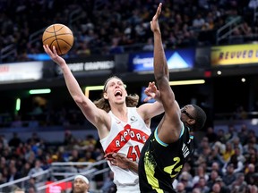 Kelly Olynyk (41) of the Toronto Raptors shoots the ball while defended by Jalen Smith (25) of the Indiana Pacers at Gainbridge Fieldhouse on Feb. 26, 2024, in Indianapolis, Ind.