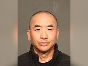 Jin Ming Han was arrested in connection with a house fire in Coquitlam on Oct. 7, 2022.