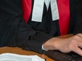 Court trial judge in a courtroom. Photo: Cliff MacArthur/provincialcourt.bc.ca