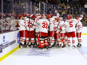 Boston University players celebrate after winning the Sioux Falls Regional against Minnesota in an NCAA college hockey tournament, Saturday, March 30, 2024, in Sioux Falls, S.D.