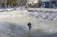 Ryan Scheer takes advantage of a sheet of ice formed in the former London Drugs location at E. Hastings and Penticton Streets in Vancouver on Saturday, Jan. 13, 2024.