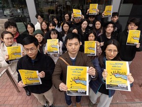 Zongwang Wang, front centre, with students in Vancouver on March 24. He left a lucrative position as an investment adviser in the U.S. to pursue a master's degree in computer science in B.C.