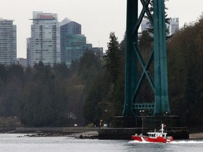 B.C. officials have been aware of the risk of a ship striking the Lions Gate Bridge, pictured here, and Ironworkers Memorial bridges for almost a decade, but plans to install enhanced collision barriers on both bridges remain in the early stages.