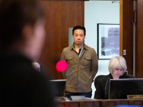 Mayor Ken Sim listens to former park board commissioner Sarah Blyth speak to city council at Vancouver City Hall in Vancouver on Dec. 12, 2023.