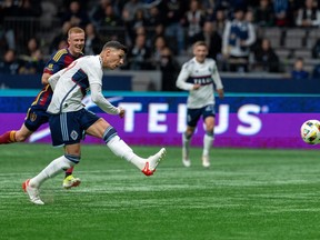 Vancouver Whitecaps' Damir Kreilach (19) scores against Real Salt Lake during the first half of an MLS soccer match in Vancouver, Saturday, March 23, 2024