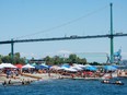 Spectators and paddlers gather for the Swa?ywey? (Ambleside Beach) Canoe Races hosted by Squamish Nation July 1, 2023. Nick Laba / North Shore News