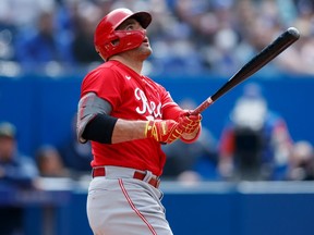 Joey Votto #19 of the Cincinnati Reds hits a solo home run in the eighth inning of their MLB game against the Toronto Blue Jays at Rogers Centre on May 22, 2022 in Toronto, Canada.