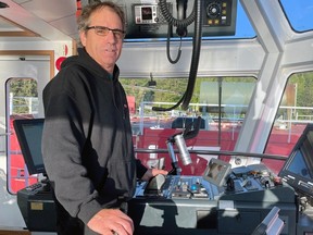 Dave Dawson, retired Vancouver tugboat operator, pictured at the helm of a tugboat before he retired.