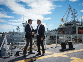 Canadian Prime Minister Justin Trudeau (left) greets Polish President Andrzej Duda aboard HMCS Regina at Canadian Forces Base Esquimalt, in Esquimalt, Canada, on April 20, 2024.