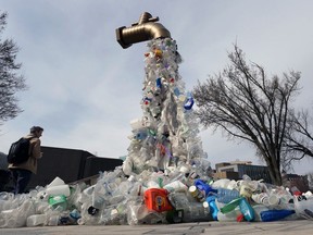 A sculpture titled Giant Plastic Tap, by Canadian artist Benjamin Von Wong, is displayed outside the fourth session of the UN Intergovernmental Negotiating Committee on Plastic Pollution in Ottawa on April 23.