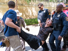 An anti-Israel protestor is arrested at the University of Texas in Austin, Texas, on April 29, 2024.