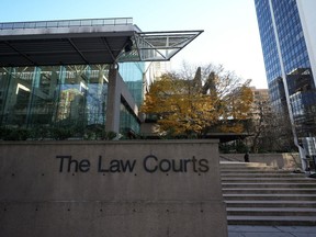 The Law Courts building, which is home to B.C. Supreme Court and the Court of Appeal, is seen in Vancouver, on Thursday, November 23, 2023. A defence lawyer for Ibrahim Ali, who was convicted of the first-degree murder of a 13-year-old girl in Burnaby, B.C., says his client wants to appear at his sentencing hearing by video over fear for his safety.