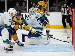 Vegas Golden Knights center William Karlsson (71) scores against Vancouver Canucks goaltender Casey DeSmith (29) during the second period on Tuesday night in Las Vegas.