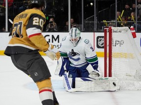 Vancouver Canucks goaltender Casey DeSmith (29) stops a shot attempt by the Vegas Golden Knights during the second period of an NHL hockey game Tuesday, April 2, 2024, in Las Vegas.