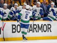 Vancouver Canucks right wing Brock Boeser (6) celebrates his first goal against the Nashville Predators with teammates during the first period in Game 4 of an NHL hockey Stanley Cup first-round playoff series Sunday, April 28, 2024, in Nashville, Tenn.