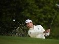 Nick Taylor, of Canada, hits from the bunker on the 10th hole during a practice round in preparation for the Masters golf tournament at Augusta National Golf Club Wednesday, April 10, 2024, in Augusta, Ga.