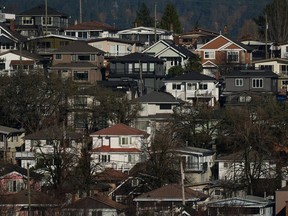 British Columbia has added eight new sites to its list of BC Builds properties, where public land owned by the province, non-profits or community groups can be used to build middle-class housing. Houses are seen on a hill in Vancouver, on Thursday, Nov. 23, 2023.