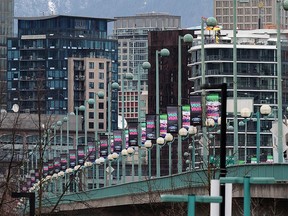 File photo of The Cambie Street Bridge with Vancouver Sun Run banners. The bridge is closed Thursday overnight for a film shoot, then again on Sunday for the annual 10K run.