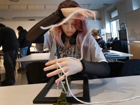 Imogen McMahon of Coquitlam does some weaving during a recent Teen Art Group workshop. The Teen Art Group, run by the Vancouver Art Gallery and Emily Carr University, is an eight month program that gives teens ages 15 to 18 in-depth exposure to art and artists.