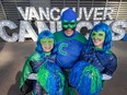 Captain Canuck and his two trusty sidekicks Desiree Armstrong, left, and Jillian Good in front of Rogers Arena April 23, 2024.