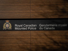 The B.C. RCMP Divisional Headquarters is seen, in Surrey, B.C., on Thursday, Jan. 11, 2024. The first police officer to enter a room where a woman was being held hostage in 2019 has told a B.C. coroner's inquest that he saw her lying on a bed on top of her captor, who was holding a knife to her throat with a gun in his other hand.