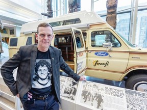 Darrell Fox wears a Terry Fox T-shirt at the Royal B.C. Museum on Wednesday as he stands beside the Ford Econoline van his brother used as a support vehicle for the 1980 Marathon of Hope. DARREN STONE, TIMES COLONIST
