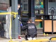Investigators with Victoria police and the Vancouver Island Integrated Major Crime Unit work at the scene of a fatal stabbing on Douglas Street near Burnside Road on April 9, 2024. DARREN STONE, TIMES COLONIST
