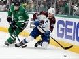 Mikko Rantanen of the Colorado Avalanche dives for the puck against Esa Lindell of the Dallas Stars during the second period in Game 5 of the Second Round of the 2024 Stanley Cup Playoffs at American Airlines Center on May 15, 2024 in Dallas, Texas.
