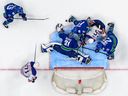 Arturs Silovs  of the Vancouver Canucks makes a save against Dylan Holloway  of the Edmonton Oilers during the 3rd period in Game One of the Second Round of the 2024 Stanley Cup Playoffs.