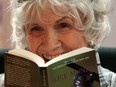 Alice Munro holds one of her books as she receives her Man Booker International award at Trinity College Dublin, in Dublin, Ireland, on June 25, 2009.