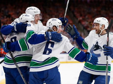 EDMONTON, ALBERTA - MAY 12: Brock Boeser #6 of the Vancouver Canucks celebrates with teammates after a hat trick during the first period against the Edmonton Oilers in Game Three of the Second Round of the 2024 Stanley Cup Playoffs at Rogers Place on May 12, 2024 in Edmonton, Alberta.