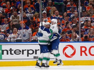 EDMONTON, ALBERTA - MAY 12: Elias Lindholm #23 of the Vancouver Canucks celebrates with teammates after a goal during the second period against the Edmonton Oilers in Game Three of the Second Round of the 2024 Stanley Cup Playoffs at Rogers Place on May 12, 2024 in Edmonton, Alberta.