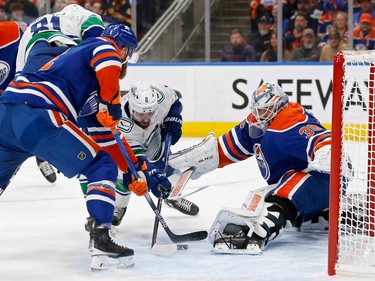 Calvin Pickard #30 of the Edmonton Oilers makes a save against Conor Garland #8 of the Vancouver Canucks during the first period in Game Four of the Second Round of the 2024 Stanley Cup Playoffs at Rogers Place on May 14, 2024 in Edmonton, Alberta.