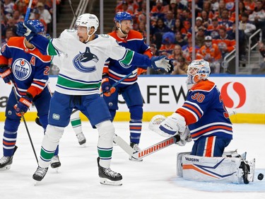 EDMONTON, ALBERTA - MAY 14: Dakota Joshua #81 of the Vancouver Canucks reacts after a goal by Conor Garland #8 during the third period against the Edmonton Oilers in Game Four of the Second Round of the 2024 Stanley Cup Playoffs at Rogers Place on May 14, 2024 in Edmonton, Alberta.