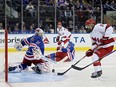 Igor Shesterkin of the New York Rangers saves a shot by Seth Jarvis of the Carolina Hurricanes during Game 5 at Madison Square Garden on May 13, 2024 in New York City.