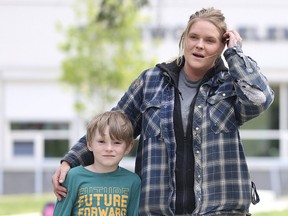 Alisha Ludlow and her son Jacob outside Edgewood Elementary School in Surrey, B.C., on May 14, 2024. Ludlow has been unable to find before and after school for her son as David Ely announced he wants to integrate such cafe into all schools. (NICK PROCAYLO/PNG)