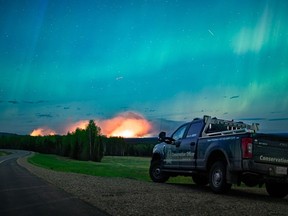 The wildfire forcing thousands to evacuate from Fort Nelson doubled again in size as the blaze grew merely a few kilometres west of city limits.