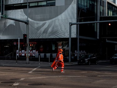 A fan makes their way to the game before the Edmonton Oilers take on the Vancouver Canucks during NHL playoff action in Edmonton on Sunday May 12, 2024.THE CANADIAN PRESS/Jason Franson
