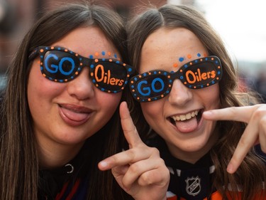 Lexi Maynard, left and Makenzie Levesque show their support for the Edmonton Oilers as they take on the Vancouver Canucks during NHL playoff action in Edmonton on Sunday May 12, 2024.THE CANADIAN PRESS/Jason Franson