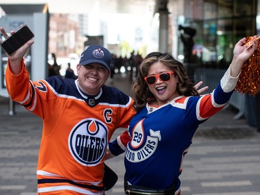 Oilers fans Scott and Cynthia Bamford show their support for the Edmonton Oilers as they take on the Vancouver Canucks during second-round NHL playoff action in Edmonton on Tuesday May 14, 2024.THE CANADIAN PRESS/Jason Franson
