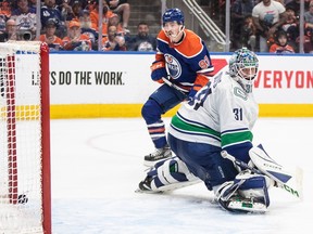 Vancouver Canucks goalie Arturs Silovs (31) is scored on by Edmonton Oilers' Ryan Nugent-Hopkins (93) during second period second-round NHL playoff action in Edmonton on Tuesday May 14, 2024.THE CANADIAN PRESS/Jason Franson