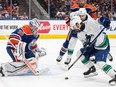 Vancouver Canucks' Conor Garland (8) is stopped by Edmonton Oilers goalie Calvin Pickard (30) during first period second-round NHL playoff action in Edmonton on Tuesday May 14, 2024.THE CANADIAN PRESS/Jason Franson
