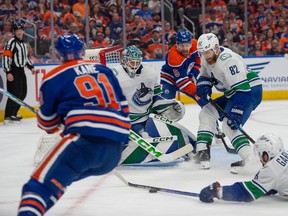 Evander Kane (91) of the Edmonton Oilers, has his shot blocked by Connor Garland (8) of the Vancouver Canucks at Rogers Place in Edmonton on May 12, 2024. Photos by Shaughn Butts-Postmedia