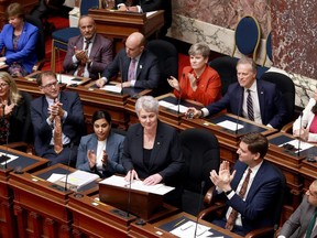 British Columbia's finance minister says she will retire after the provincial election this fall, having served in the legislature for nearly two decades. Finance Minister Katrine Conroy tables the budget in the legislative assembly at the legislature in Victoria, Thursday, Feb. 22, 2024.