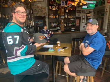 VANCOUVER, May 14, 2024 -- Dylan Johnson trolling his buddy, Oilers fan Barry Bride, at Gastown's Black Frog Eatery. PHOTO BY GORD MCINTYRE